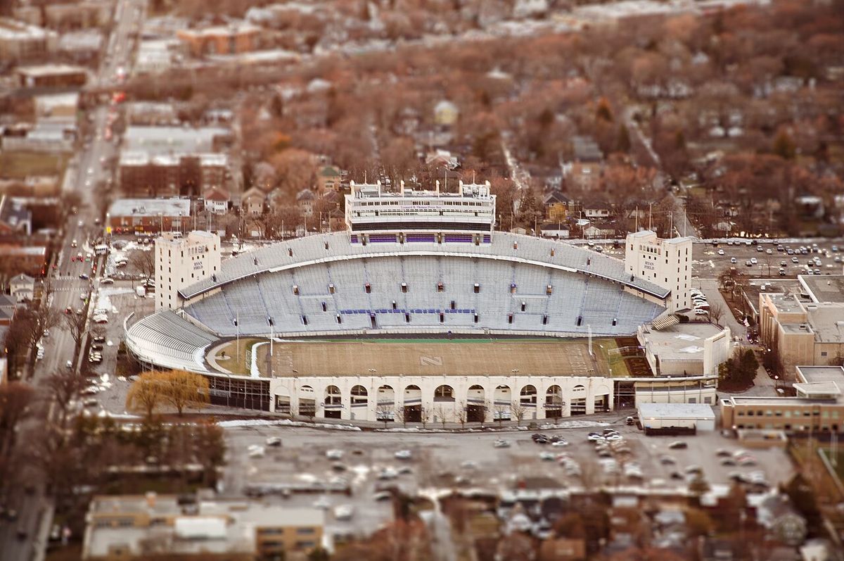 Aerial view of Northwestern's Ryan Field surrounded by neighborhoods and bare autumn trees.